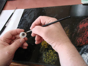 Steven R. Young, B.C.O. painting an artificial eye. 